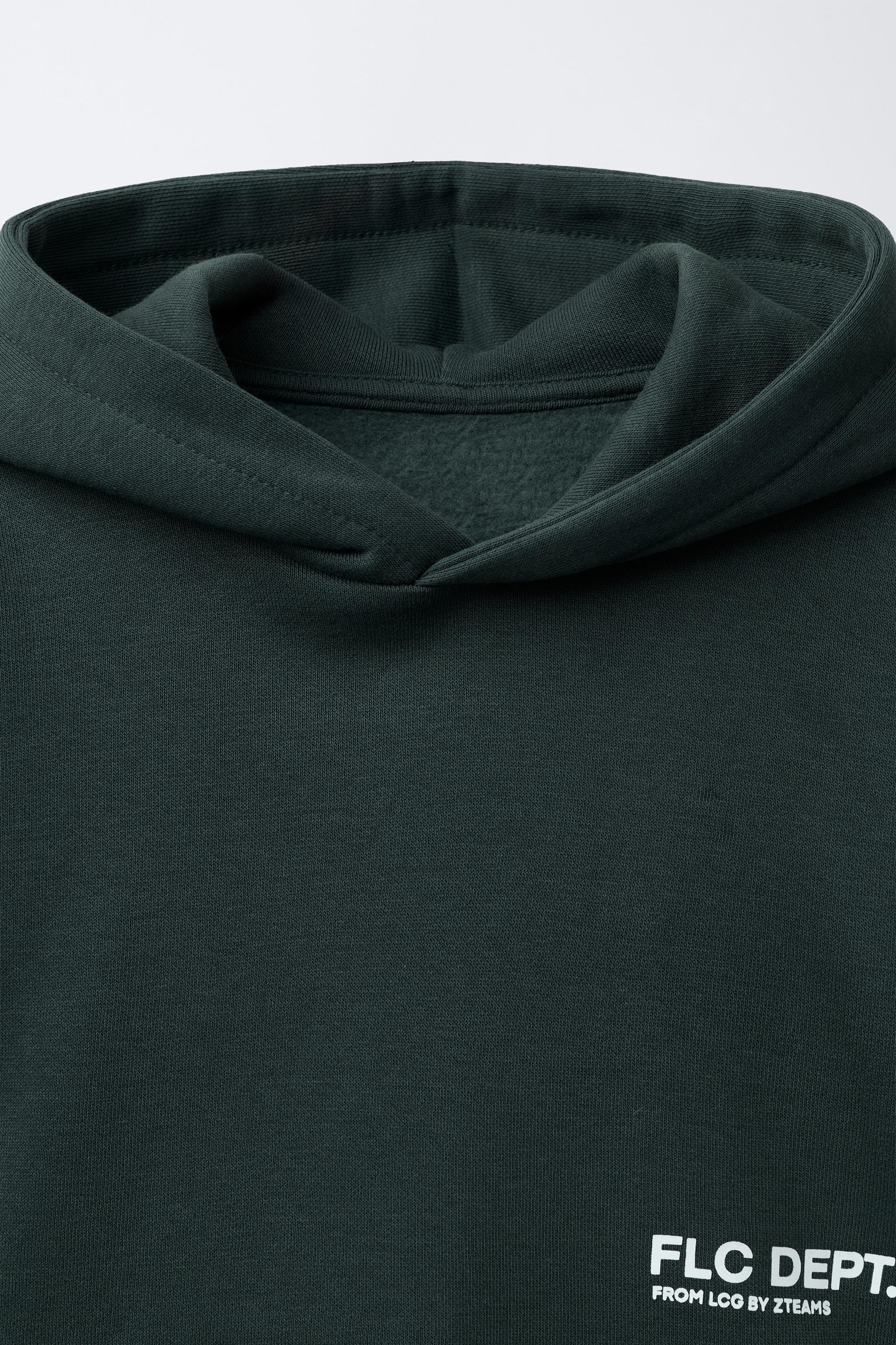 SWEAT À CAPUCHE AVEC INSCRIPTION